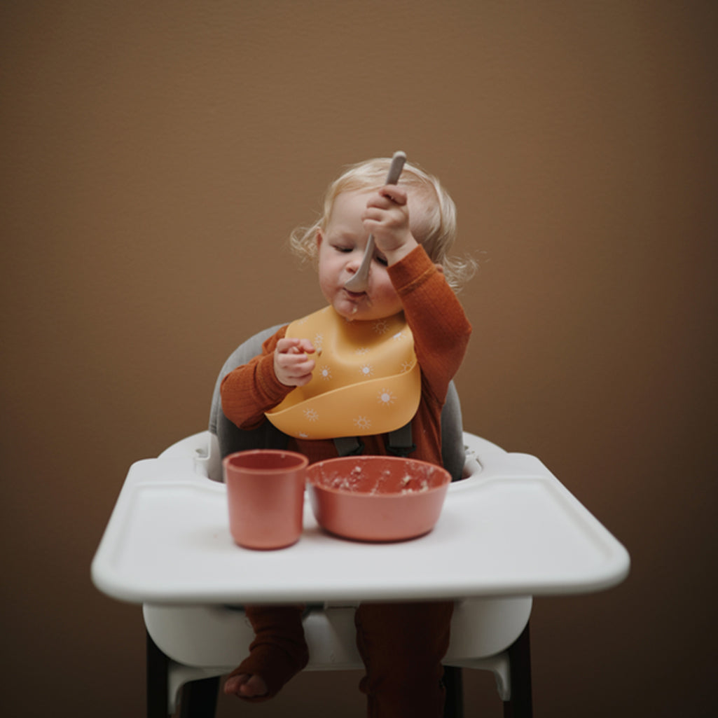 Silicone Bib with Pocket Practical silicone bib with a built-in pocket to catch food spills