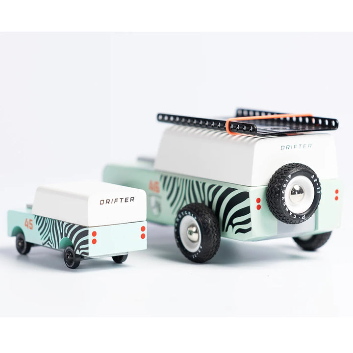 A comparison of the Candylab Mini Zebra Drifter toy car to its full-size Zebra Drifter counterpart.