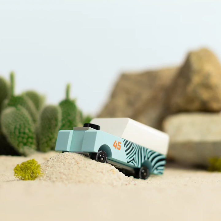 Another lifestyle image of the Candylab Mini Zebra Drifter, showing it in an active playtime environment.