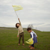 Lifestyle image of two children playing with Mini Playsilks outside.