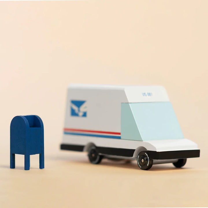 Lifestyle image of Candylab futuristic mail van toy in action during playtime.