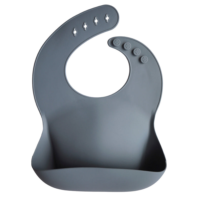 Mushie Tradewinds Stylish silicone bib in the calming Tradewinds color for easy mealtime cleanup