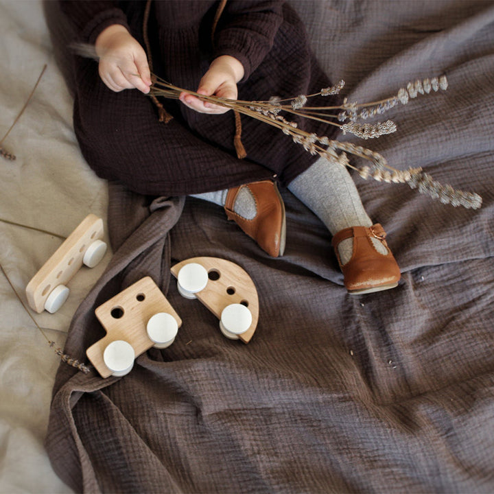 A set of wooden cars, painted by hand in retro 70's style, perfect for children's imaginative play.