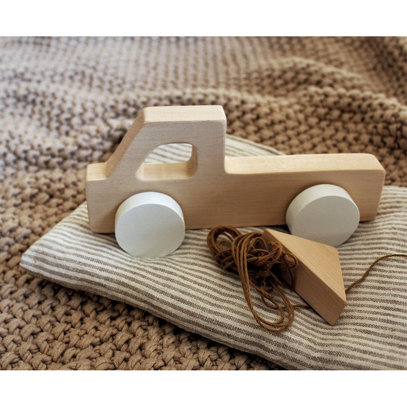 A colorful, handmade wooden toy car reflecting 1980s style for kids to play with.