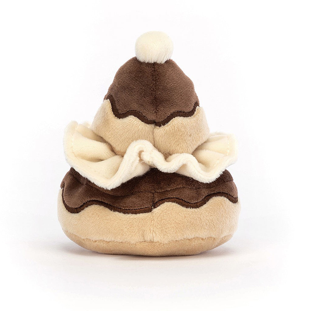 Jellycat Pretty Patisserie Religieuse Stuffed Children's Toy. Multi-layered plush toy modeled after a French pastry of the same name. Cream, tan, and brown in color with a black stitched smile and eyes.