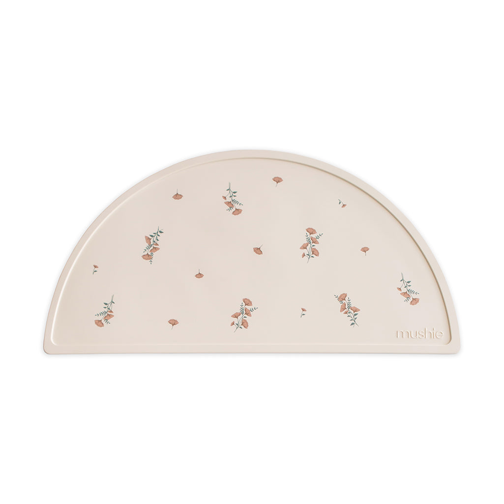 Mushie Placemat in Pink Flowers Sweet and cheerful with a soft floral print ideal for adding charm to baby meals