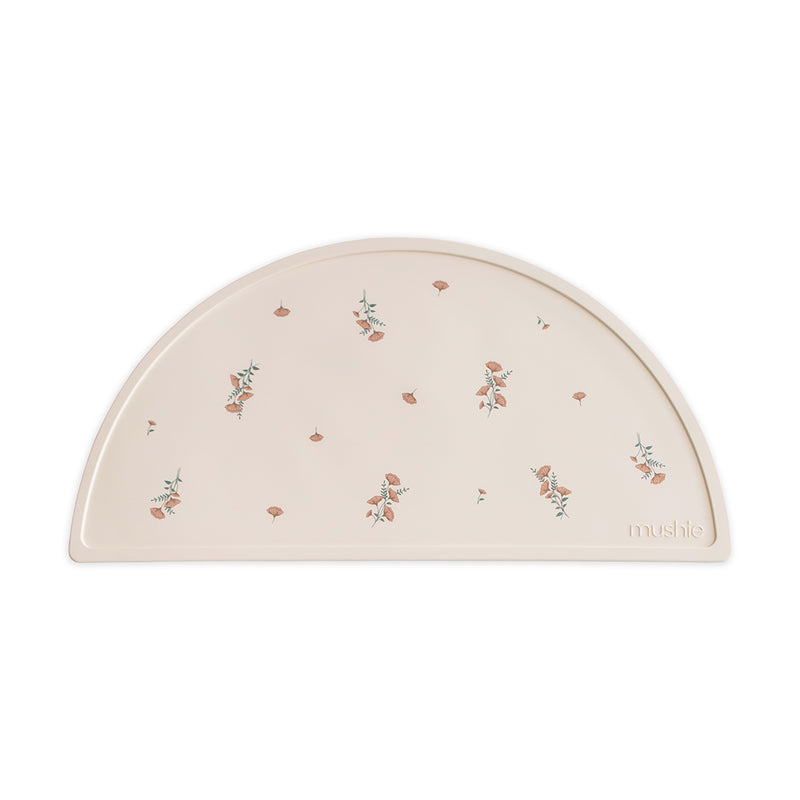 Mushie Placemat in Pink Flowers Sweet and cheerful with a soft floral print ideal for adding charm to baby meals