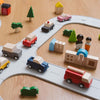 PlanToys Police toy car at play with various wooden toy vehicles