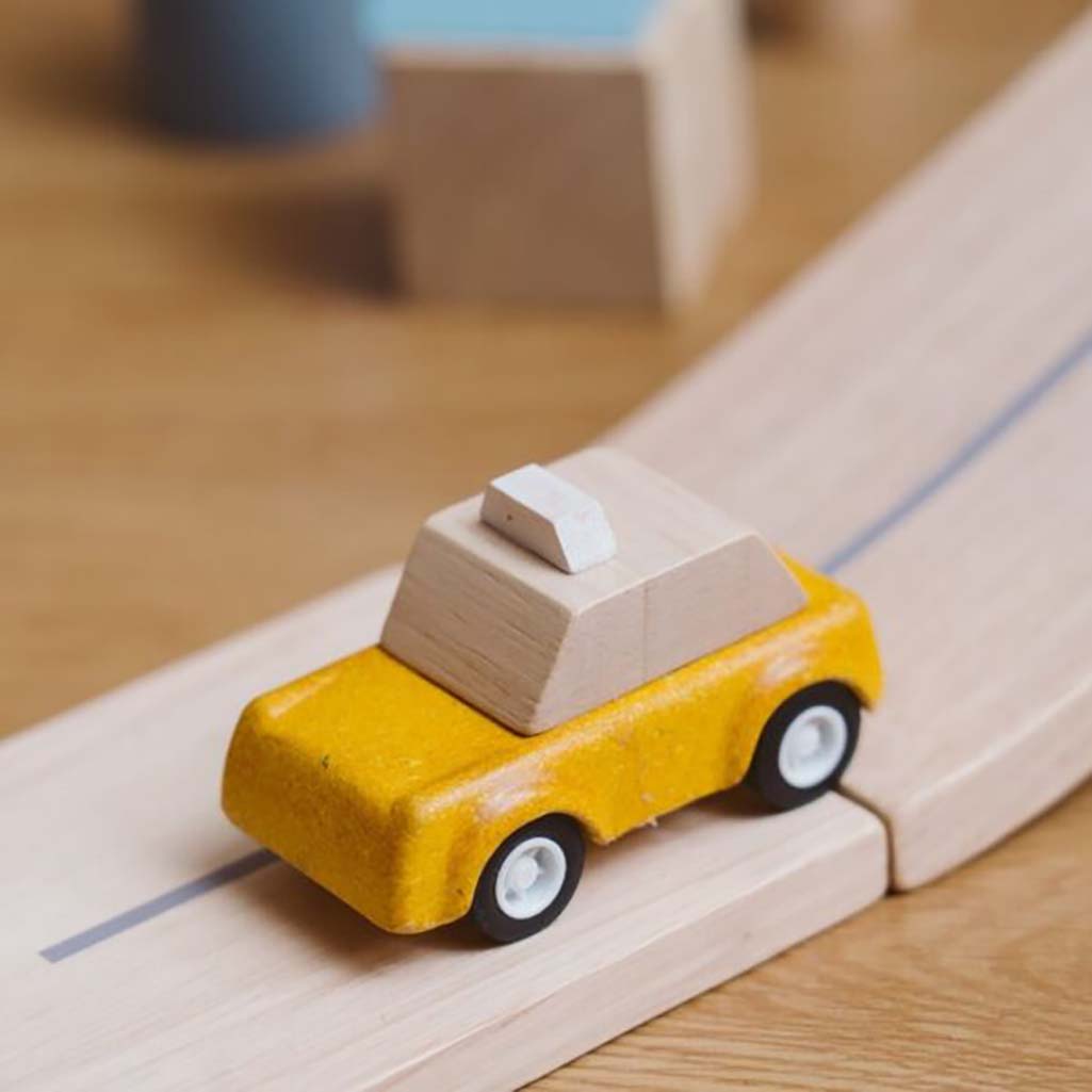 PlanToys Yellow Taxicab Wood Toys on Car Track, perfect for kids who love racing their taxicabs along wooden car tracks.