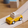 PlanToys Yellow Taxicab wood toys on car track