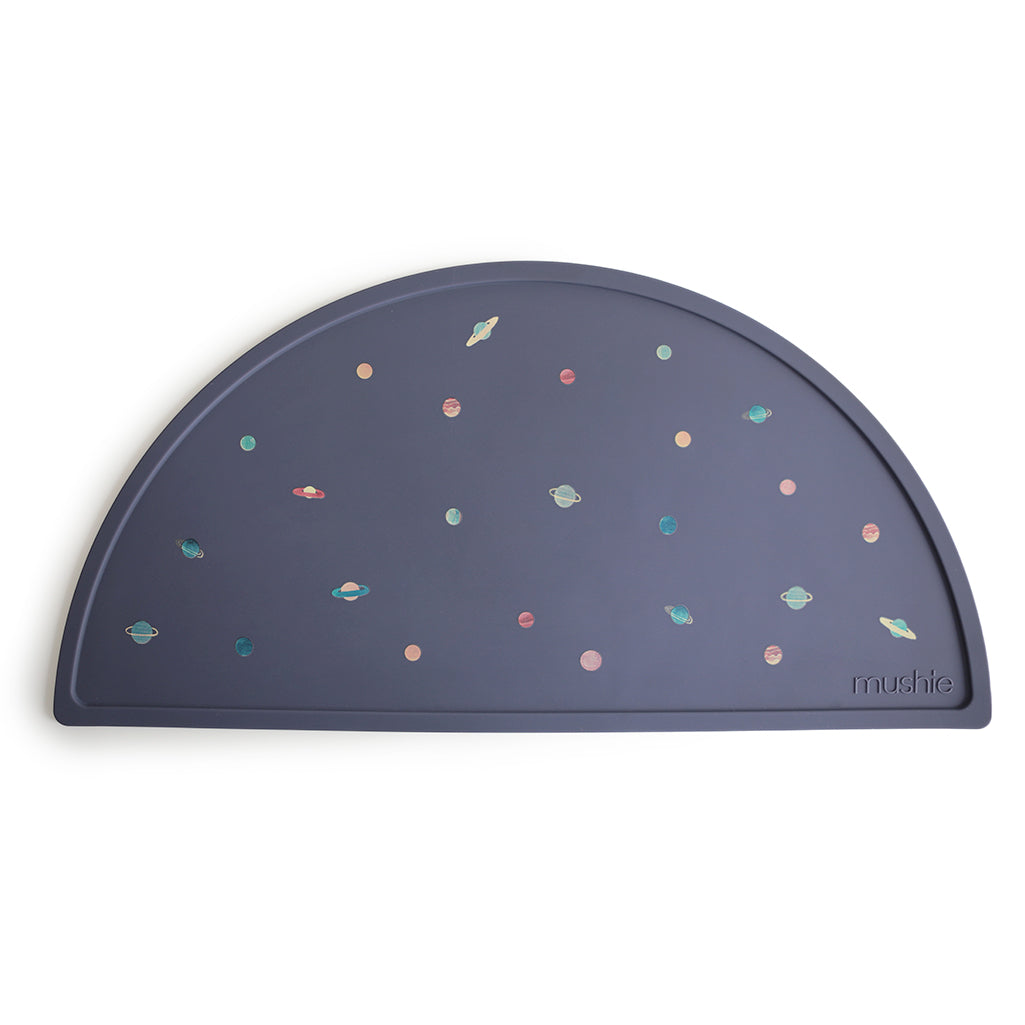 Mushie Placemat in Planets A cosmic design filled with planets perfect for sparking your child's imagination