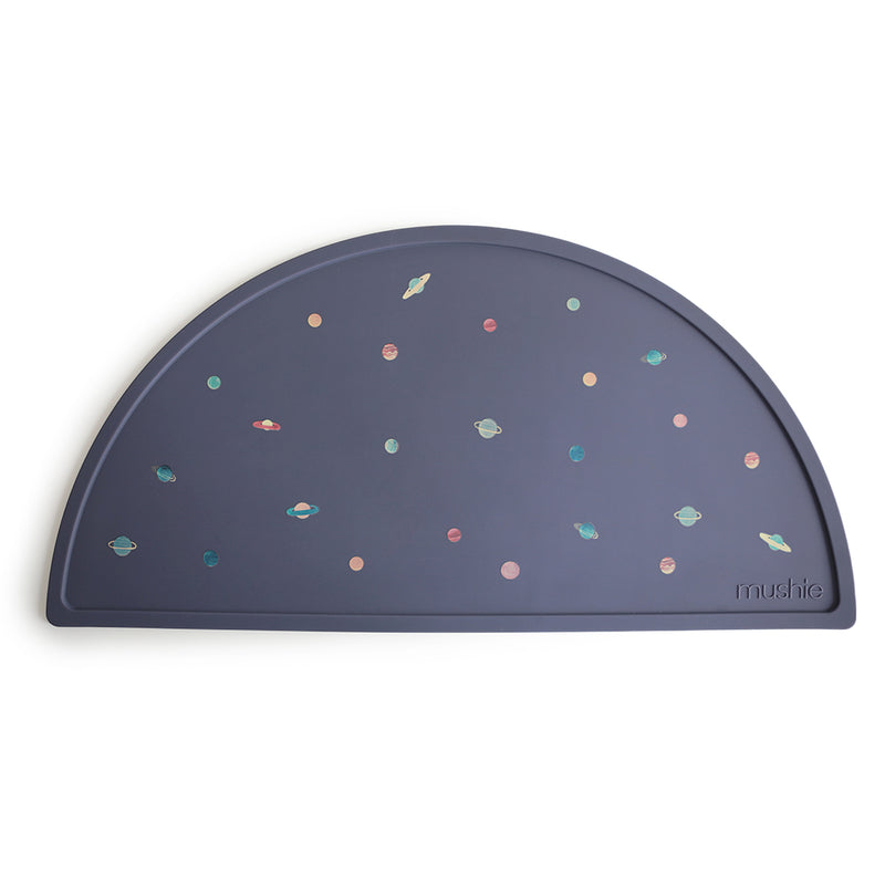 Mushie Placemat in Planets A cosmic design filled with planets perfect for sparking your child&