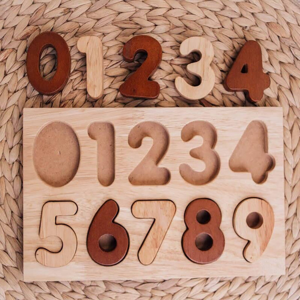 brown and beige wooden number puzzle on woven background. infant children's puzzle montessori toy