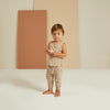 lifestyle_1, Soft slouch slub knit pant with elastic waist band and rolled cuffs for comfort. Child standing wearing slouchy pants.