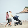 Couple walking with Uppababy Jogging Stroller