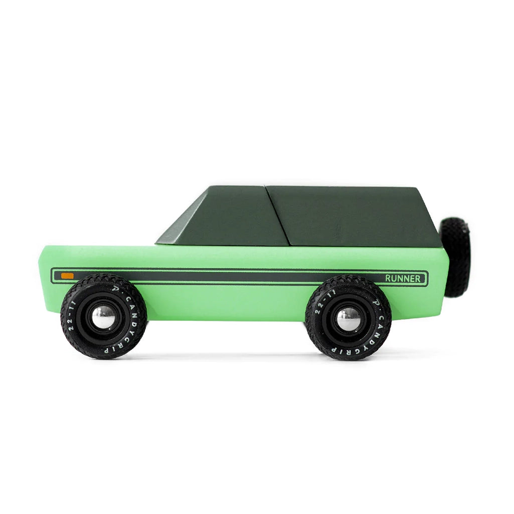 A Candylab Runner vintage toy vehicle in green and black, designed for children to explore pretend racing adventures.
