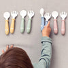 Child Picking Up BabyBjorn Spoon & Fork Set Baby Feeding Accessory