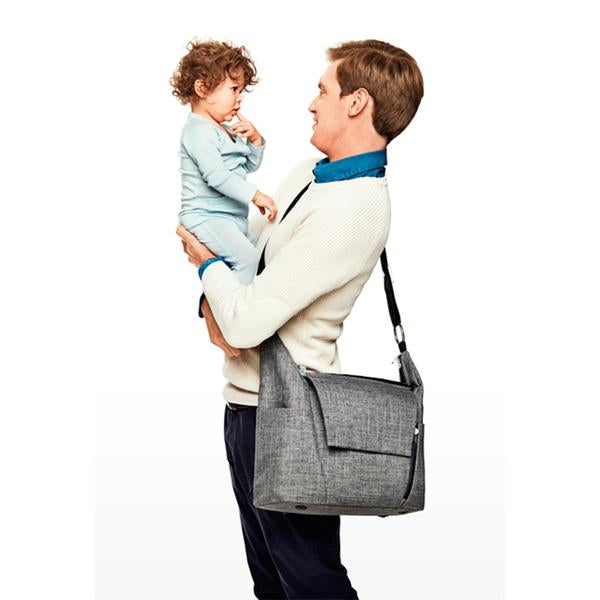 The Stokke Changing Bag in a sleek modern grey design works as a top diaper bags choice for travel.