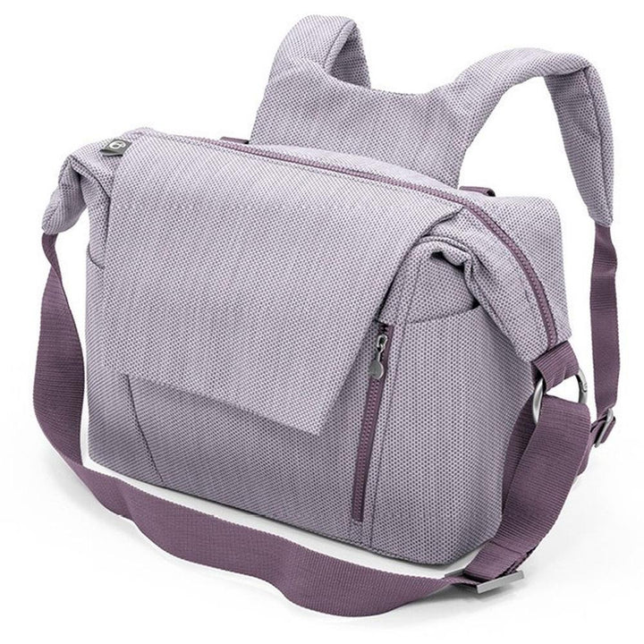 The Brushed Lilac Stokke Changing Bag is a colorful diaper bag perfect for stylish outings.
