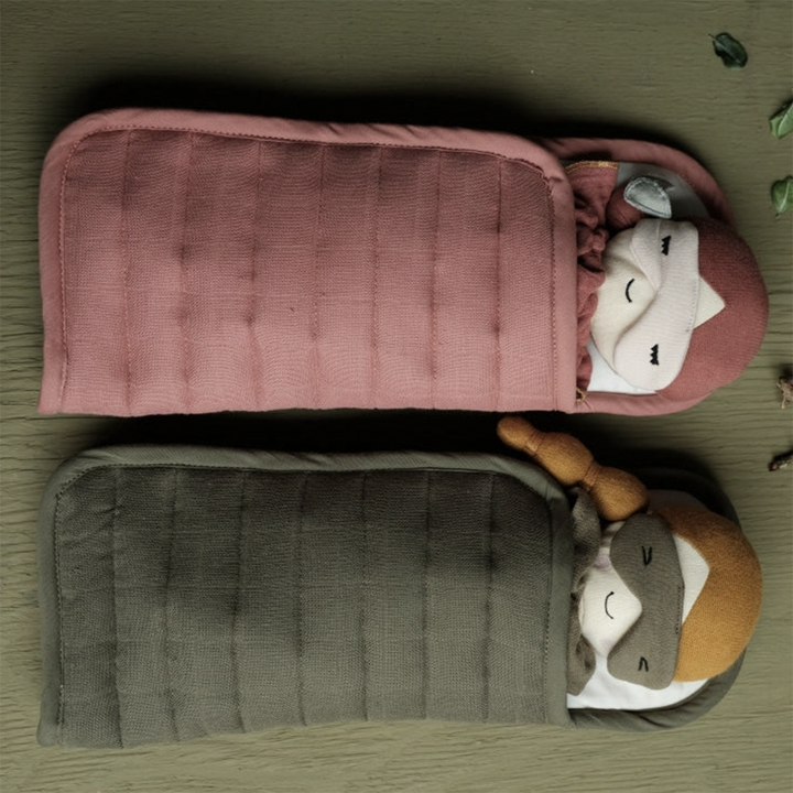 Clay sleeping bag shown with doll inside, next to Olive colored sleeping bag with doll.