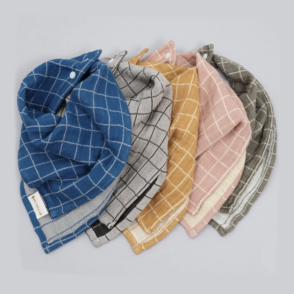 Fabelab Ochre Grid Fold-over Infant & Toddler Feeding Bib. Shown with different color variations.