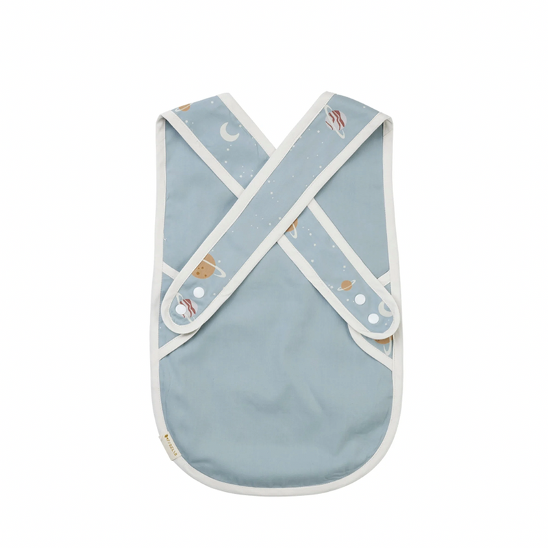 Front and Back View of Fabelab Planetary Cross Back Bib, Light Blue Cotton Baby Bib with White Piping and Planet Print