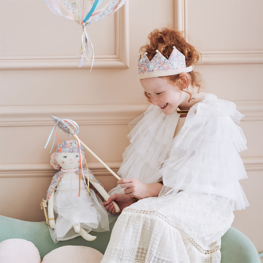 Meri Meri Floral Star Wand Children's Pretend Play Accessory. Modeled on child.