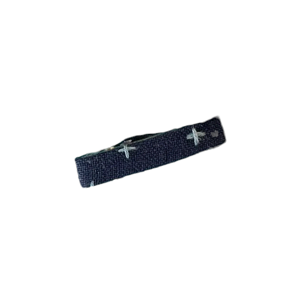 Hello Tartlet Petite Seltzer Hair Clip. Navy blue fabric covered hair clip. Light blue x's pattern.