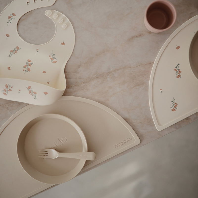 Mushie Silicone Placemat in Shifting Sand Subtle sandy tones that offer a stylish neutral background for feeding