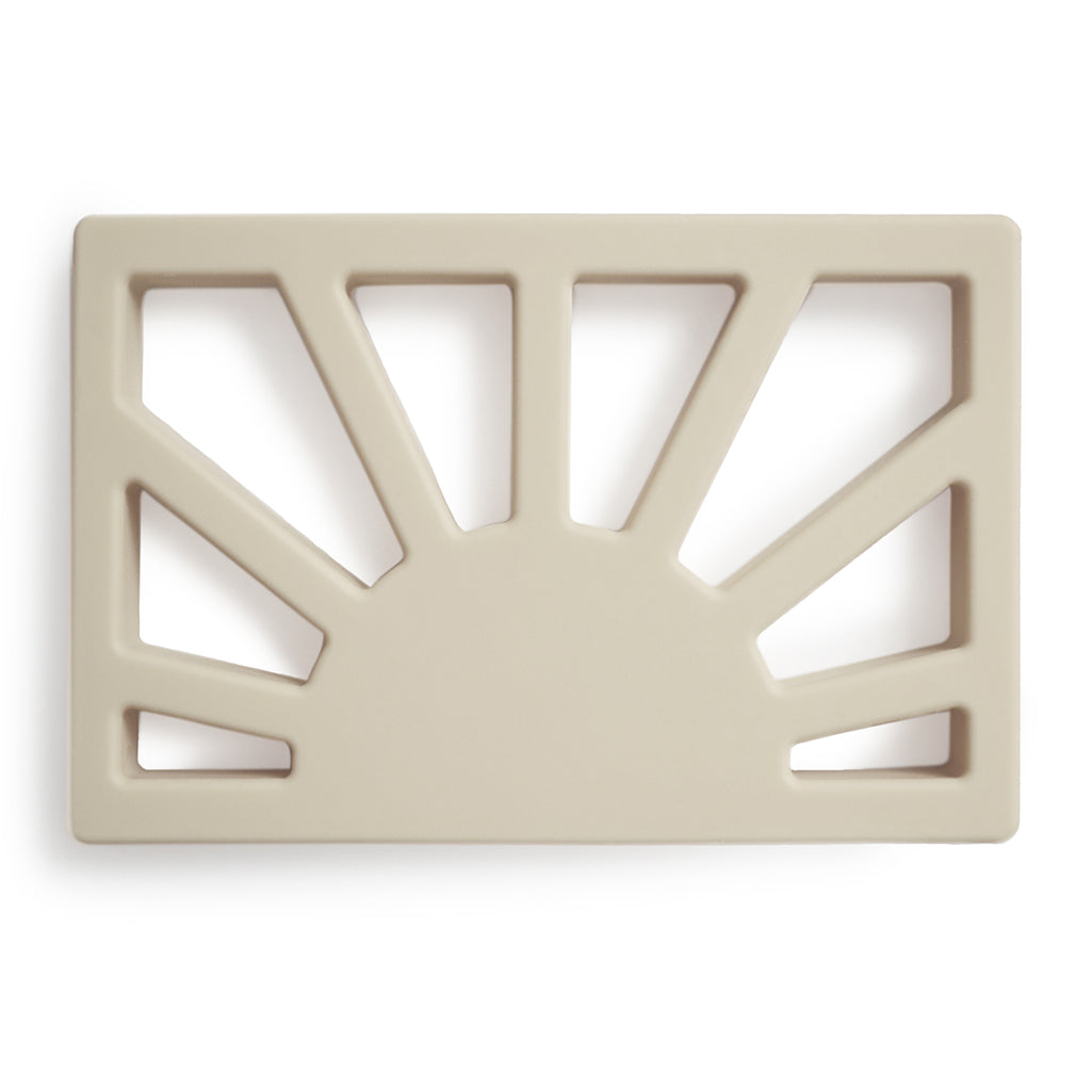 Baby Teething Baby using a teething toy to relieve discomfort during the teething process