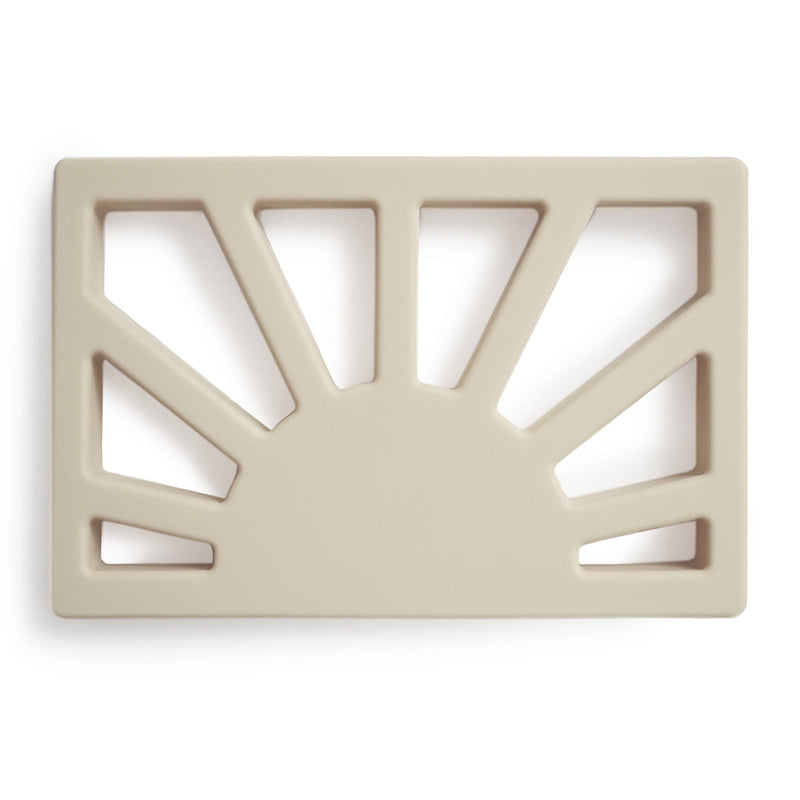 Baby Teething Baby using a teething toy to relieve discomfort during the teething process