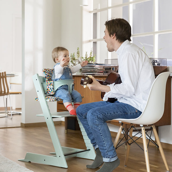 Create cozy spaces with the Stokke Tripp Trapp High Chair with Baby Set in Soft Mint which is great for highchairs for babies