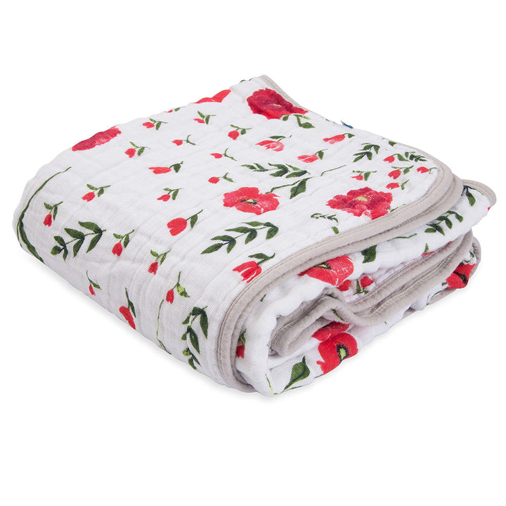 Little Unicorn Muslin Quilt in Summer Poppy offers tropical vibes and softness in a cotton baby blanket.