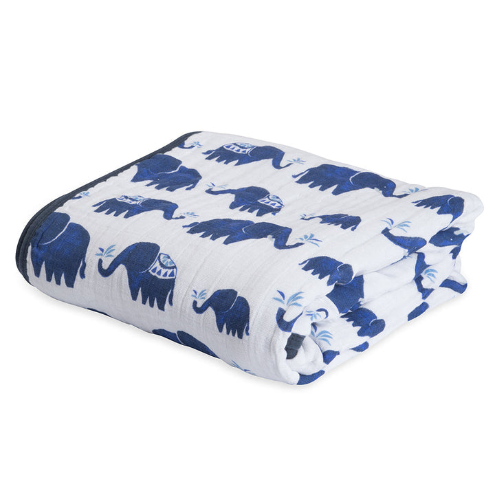 Cuddle up with the Little Unicorn Muslin Quilt in Indigo Elephant, a lightweight and breathable baby sleeping blanket.