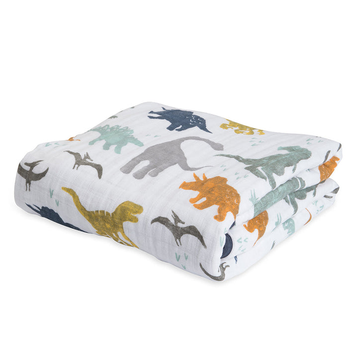 Little Unicorn Muslin Quilt in Dino Friends brings prehistoric vibes in this breathable organic cotton baby blanket.