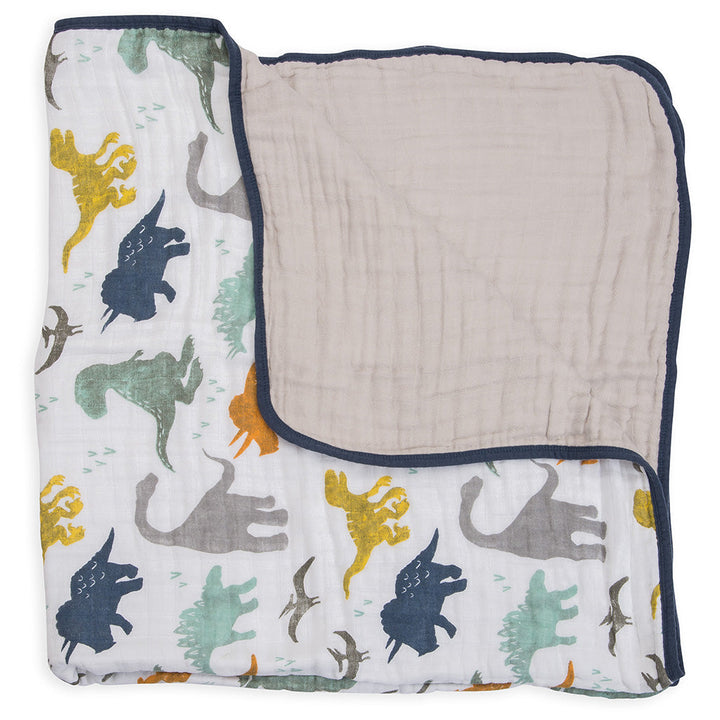 Classic and elegant, the Little Unicorn Muslin Quilt in Dino Friends is a must-have muslin baby blanket.