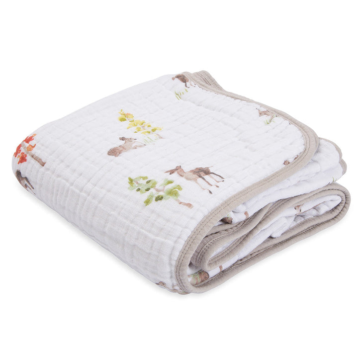 The Little Unicorn Muslin Quilt in Oh Deer wraps your little one in comfort with an organic cotton baby blanket.