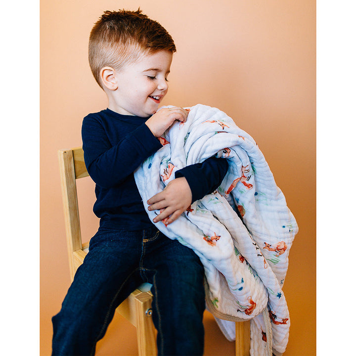 Little Unicorn Muslin Quilt in Fox brings timeless design to your nursery with this classic muslin blanket.