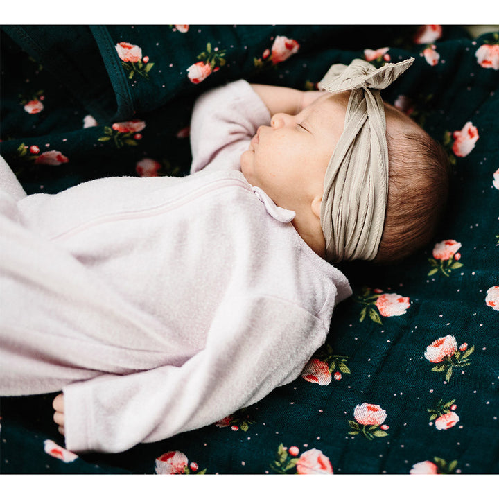 Little Unicorn Muslin Quilt in Floral Stitch, a delightful cotton baby blanket for everyday cuddles.