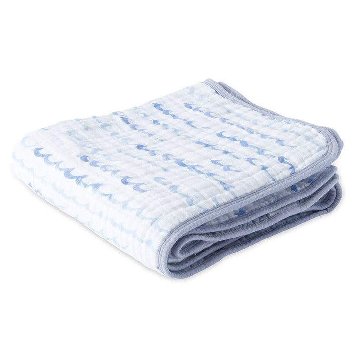 Little Unicorn Muslin Quilt in High Tide, a cozy cotton baby blanket designed for softness and style.
