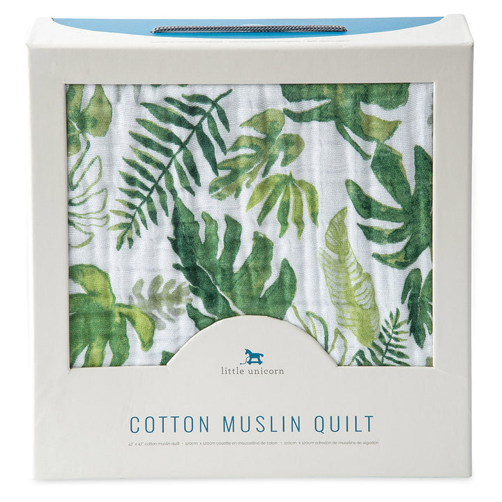 The Little Unicorn Muslin Quilt in Tropical Leaf offers a sweet woodland print, perfect for baby girl blankets.