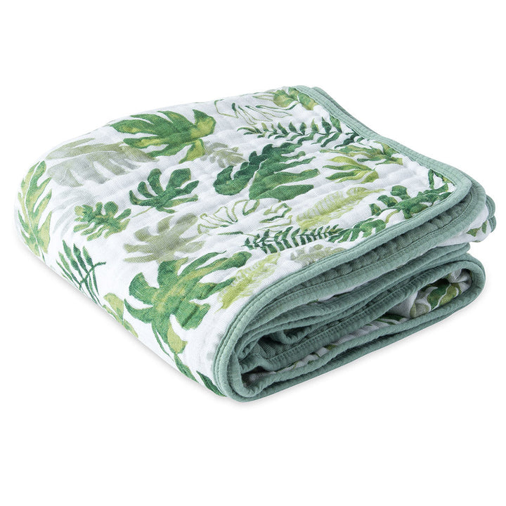 Little Unicorn Muslin Quilt in Tropical Leaf adds clean, modern design to soft, organic baby blanket comfort.