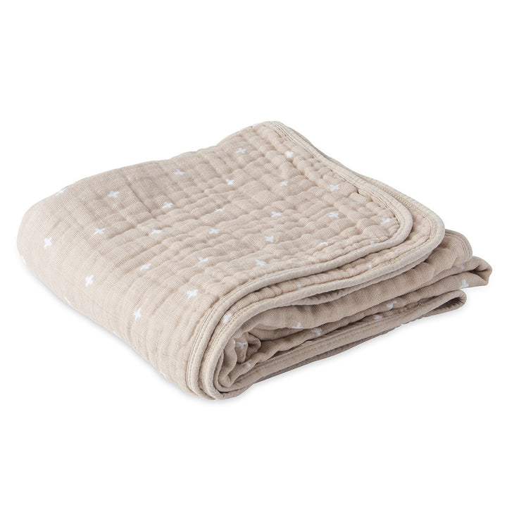 The Little Unicorn Muslin Quilt in Taupe Cross combines simplicity and breathability in a muslin baby blanket.