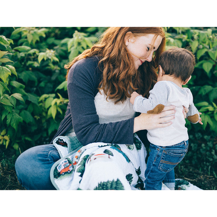 The Little Unicorn Muslin Quilt in Happy Camper is a beautiful muslin blanket baby will adore.