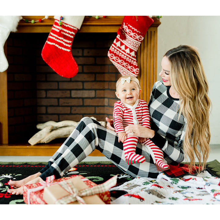 Dream big with the Little Unicorn Muslin Quilt in Holiday Haul, the softest muslin baby blanket for Christmas lovers.