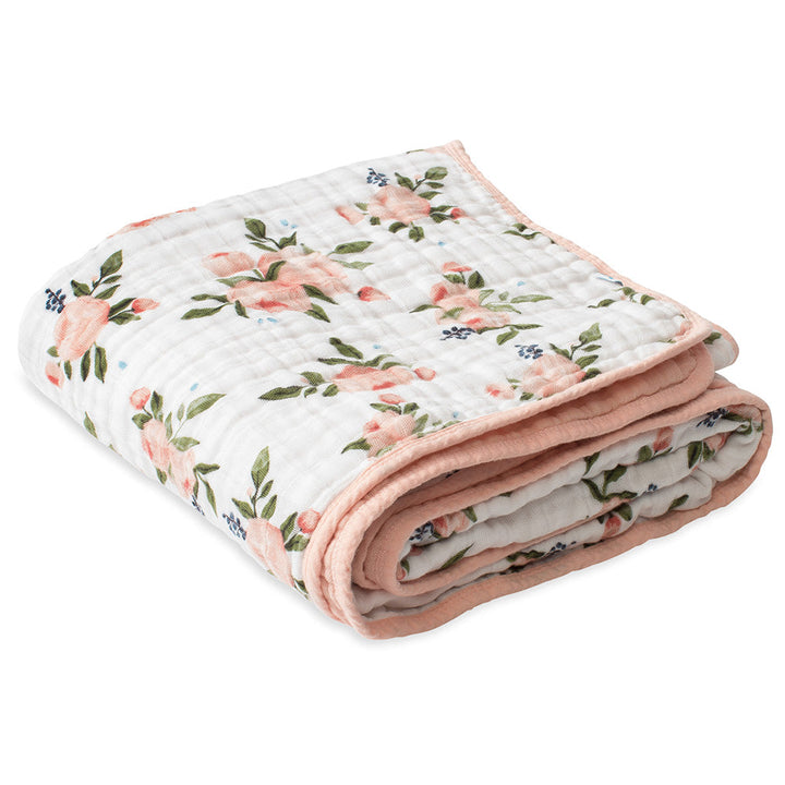 The Little Unicorn Muslin Quilt in Watercolor Roses keeps baby cozy and stylish with lightweight muslin blankets.
