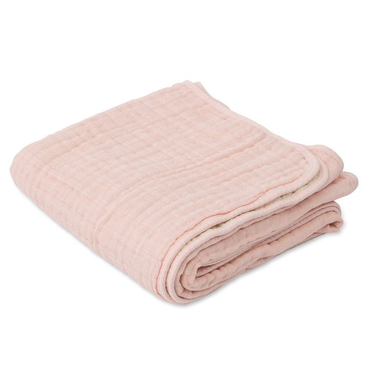 Little Unicorn Muslin Quilt in Rose Petal blends floral detail and comfort in a soft organic cotton baby blanket.