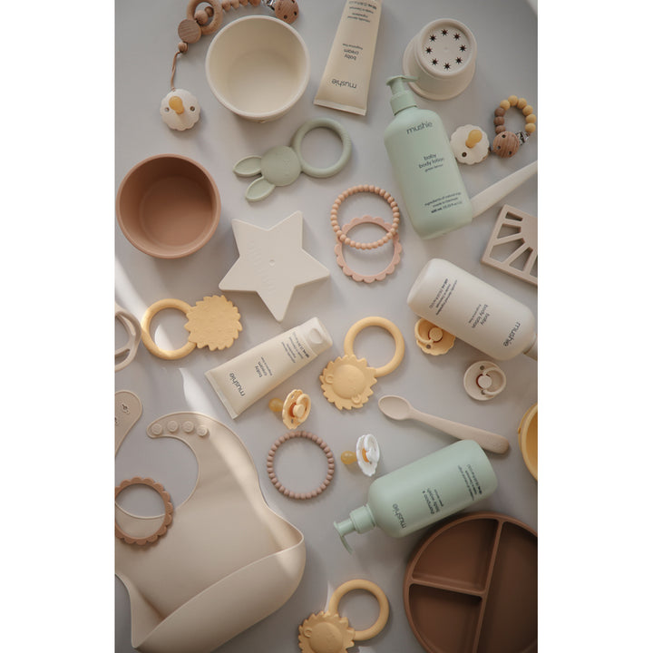 Mushie baby teether made with soft durable materials to safely help with teething pain