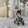 Woman walking with Uppababy Vista Stroller in Gregory