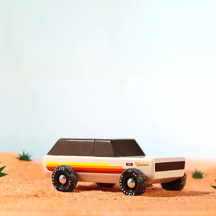 Candylab Wanderer vintage wooden toy car in desert featuring a timeless design in a desert-themed adventure scene